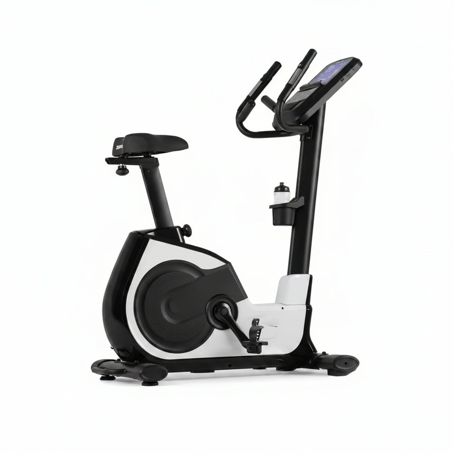 Commercial grade upright exercise bike with a touch screen display, black and white color scheme, and an adjustable seat and handlebars.