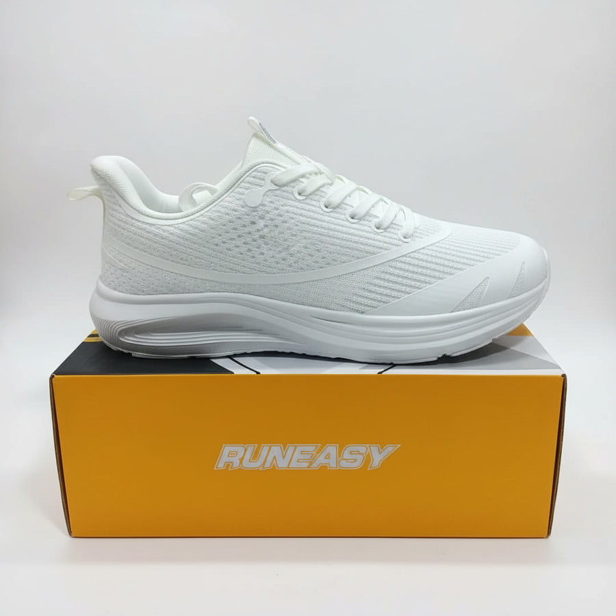 A white RunEasy athletic sneaker shown from the side, resting on top of its orange and black branded shoebox.