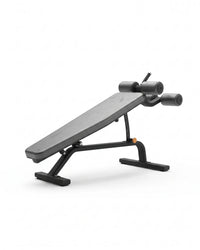 A black adjustable weight bench with a padded inclined backrest and dual roller arms, shown on a clean white background.