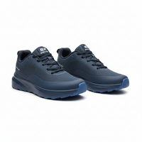 Person wearing blue running shoes with a blurred outdoor background