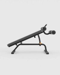 Black adjustable weight bench with a tilted flat bench plate, padded backrest, and dual cylindrical handles, shown on a light gray studio background.